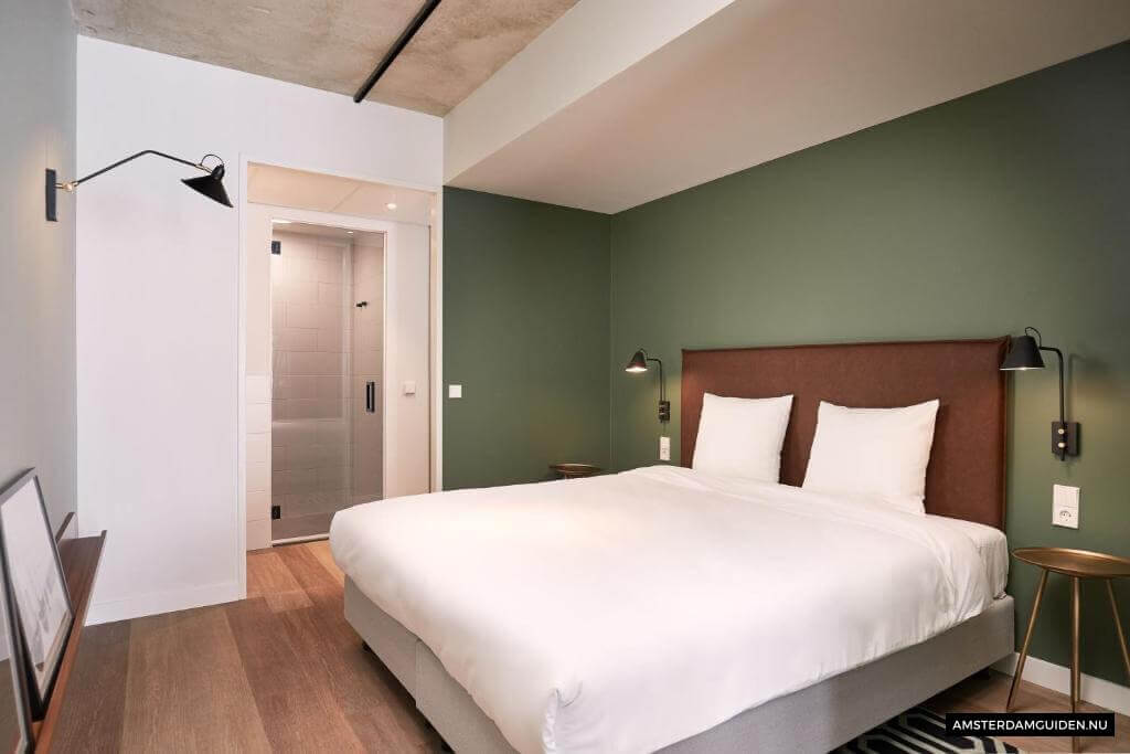 Säng eller sängar i ett rum på Corendon Apartments Amsterdam Schiphol Airport